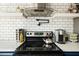 Close-up shot of a stainless steel range hood, cooktop and coffee maker in a modern kitchen at 2839 N 61St St, Scottsdale, AZ 85257