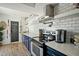 Bright kitchen features white subway tile, floating shelves, and stainless steel appliances at 2839 N 61St St, Scottsdale, AZ 85257