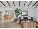 Comfortable living room with a stylish sofa, wood beams, and a view into the dining area, creating a cozy atmosphere at 2839 N 61St St, Scottsdale, AZ 85257