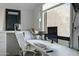 Home office featuring a modern white desk with built-ins, contemporary desk chair, and view to the exterior at 2839 N 61St St, Scottsdale, AZ 85257