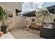 Charming patio area with cozy seating, a decorative rug, and a stylish 'Good Vibes Only' pillow at 2839 N 61St St, Scottsdale, AZ 85257