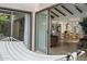 Relaxing patio with a hammock, overlooking the bright interior with wood floors and dining area at 2839 N 61St St, Scottsdale, AZ 85257