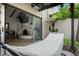 Cozy patio featuring a hammock, fireplace, and sliding glass doors to the living area at 2839 N 61St St, Scottsdale, AZ 85257