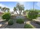 Attractive 'Las Casas Scottsdale' sign surrounded by lush landscaping and mature trees at 2839 N 61St St, Scottsdale, AZ 85257