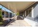 Long carport and shaded parking area on the side of a charming single-story home at 303 S Recker Rd # 141, Mesa, AZ 85206