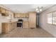 Well-lit kitchen featuring functional cabinetry and tile flooring at 303 S Recker Rd # 141, Mesa, AZ 85206
