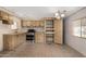 The open kitchen offers tile floor and ample cabinet space at 303 S Recker Rd # 141, Mesa, AZ 85206