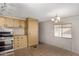 Bright kitchen featuring functional cabinetry and tile flooring at 303 S Recker Rd # 141, Mesa, AZ 85206