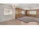 Spacious living room area with tile and carpet, ceiling fan, and ample natural light at 303 S Recker Rd # 141, Mesa, AZ 85206