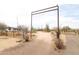 Long driveway leading to a desert property with mature trees and vegetation at 36655 N 25Th St, Cave Creek, AZ 85331