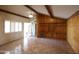 Living room featuring tile floors, wood-beam accents and shuttered windows at 36655 N 25Th St, Cave Creek, AZ 85331