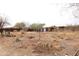 View of desert property with storage sheds and natural vegetation at 36655 N 25Th St, Cave Creek, AZ 85331
