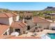 Aerial view showcasing a luxurious residence with desert landscaping and a red tile roof at 3723 S Pottery Rd, Gold Canyon, AZ 85118