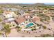 Wide aerial shot showcasing the home's pool, patio, fire pit, and surrounding desert landscape at 3723 S Pottery Rd, Gold Canyon, AZ 85118
