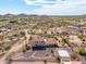 Aerial view of desert property with home, pool, fire pit, and basketball court at 3723 S Pottery Rd, Gold Canyon, AZ 85118