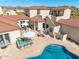 Aerial view of a luxurious desert residence with a pool, outdoor kitchen and desert landscaping at 3723 S Pottery Rd, Gold Canyon, AZ 85118