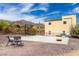 Spacious backyard featuring a concrete area, a basketball hoop, and outdoor games for recreation at 3723 S Pottery Rd, Gold Canyon, AZ 85118