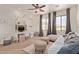 Bright bedroom with stylish furniture, a ceiling fan and natural light at 3723 S Pottery Rd, Gold Canyon, AZ 85118