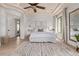 Light, airy bedroom with trey ceilings, white bedding, and natural light from the large window at 3723 S Pottery Rd, Gold Canyon, AZ 85118