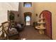 Inviting courtyard entrance, showcasing a water feature and outdoor seating under the bright sky at 3723 S Pottery Rd, Gold Canyon, AZ 85118