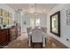 Spacious dining room with tray ceiling, decorative lighting, and seating for ten at 3723 S Pottery Rd, Gold Canyon, AZ 85118