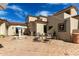 Expansive courtyard featuring a fountain, seating areas, and beautiful home architecture at 3723 S Pottery Rd, Gold Canyon, AZ 85118