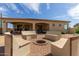 Outdoor fire pit with built-in seating, creating a cozy space for gathering and relaxation at 3723 S Pottery Rd, Gold Canyon, AZ 85118