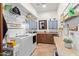 Bright laundry room with modern appliances, custom cabinetry, and ample counter space at 3723 S Pottery Rd, Gold Canyon, AZ 85118