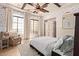 Tranquil main bedroom with large windows, ceiling fan, and sitting area at 3723 S Pottery Rd, Gold Canyon, AZ 85118