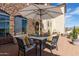 Elegant patio area with dining set, comfortable seating, and views of lush landscape at 3723 S Pottery Rd, Gold Canyon, AZ 85118