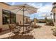 Outdoor patio with seating area, umbrella, and views of pool and desert landscape at 3723 S Pottery Rd, Gold Canyon, AZ 85118