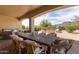 Spacious covered patio with outdoor dining and seating, offering scenic views for entertaining at 3723 S Pottery Rd, Gold Canyon, AZ 85118