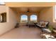 Comfortable covered patio with wrought iron details and stylish furniture at 3723 S Pottery Rd, Gold Canyon, AZ 85118