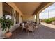 Relaxing patio area with an outdoor dining table and a comfortable seating area, ideal for gatherings at 3723 S Pottery Rd, Gold Canyon, AZ 85118