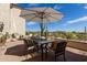 Outdoor patio featuring comfortable seating, a dining set, and desert views at 3723 S Pottery Rd, Gold Canyon, AZ 85118