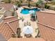 Aerial view of backyard with beautiful pool, outdoor kitchen, fountain and patio seating at 3723 S Pottery Rd, Gold Canyon, AZ 85118