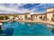 Beautiful backyard pool area with outdoor seating, a bar, and mountain views at 3723 S Pottery Rd, Gold Canyon, AZ 85118