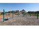 Community playground with climbing structures and swings in a neighborhood setting with landscaping and clear sky at 4179 W Brenley Dr, San Tan Valley, AZ 85144