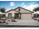 Charming single-story home featuring a two-car garage and stone accents on the facade with desert landscaping at 4204 W Brenley Dr, San Tan Valley, AZ 85144
