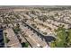 Planned community aerial view with homes neatly arranged along tree-lined streets at 4626 N 111Th Ln, Phoenix, AZ 85037