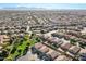 Expansive aerial view of a residential community, showcasing the neighborhood layout and mountain backdrop at 4626 N 111Th Ln, Phoenix, AZ 85037