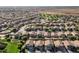 Aerial view of a community featuring lush green spaces and desert views in the background at 4626 N 111Th Ln, Phoenix, AZ 85037