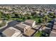 Overhead view of a residential neighborhood with green spaces, yards, and neatly arranged homes at 4626 N 111Th Ln, Phoenix, AZ 85037