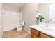 Well-lit bathroom with a shower-tub combo, tile floors and modern vanity at 4626 N 111Th Ln, Phoenix, AZ 85037