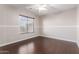 Comfortable bedroom with hardwood floors, natural light and modern ceiling fan at 4626 N 111Th Ln, Phoenix, AZ 85037