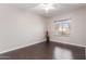 Charming bedroom with hardwood floors, natural light and window with blinds at 4626 N 111Th Ln, Phoenix, AZ 85037