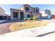 Well-maintained home with green lawn, desert landscape, and spacious driveway at 4626 N 111Th Ln, Phoenix, AZ 85037