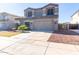 Exterior of the home with a desert landscaped front yard and a spacious concrete driveway at 4626 N 111Th Ln, Phoenix, AZ 85037