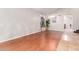 A spacious living room with hardwood floors and a large window with natural light at 4626 N 111Th Ln, Phoenix, AZ 85037
