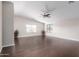 Expansive living room showcasing neutral decor and wood floors, perfect for entertaining and relaxing at 4626 N 111Th Ln, Phoenix, AZ 85037